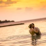 woman-and-man-kissing-in-body-of-water-1024991
